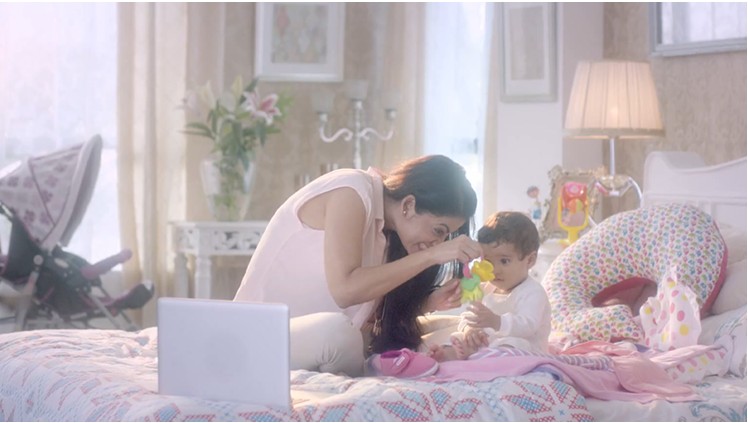 A modern, multitasking mother at home