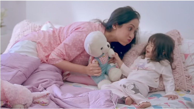 Mother and child in pyjamas at bedtime