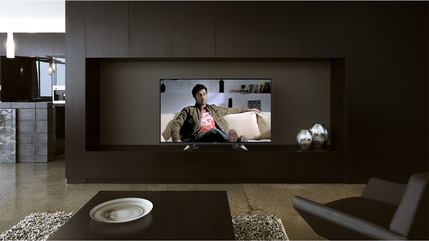 Panasonic Viera TV built into a dark modern living room