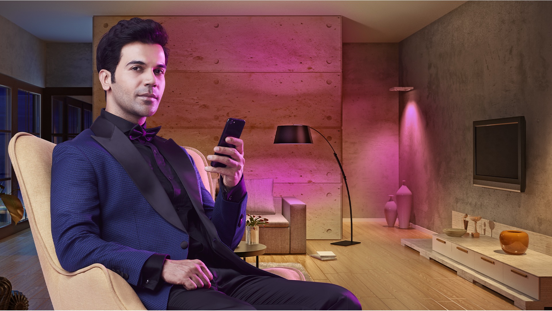 Syska brand ambassador in a modern, LED-lit living room